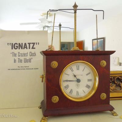 Rare flying pendulum clock with instructions.