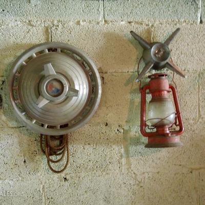 Vintage hub caps and hanging red hurricane lamp.