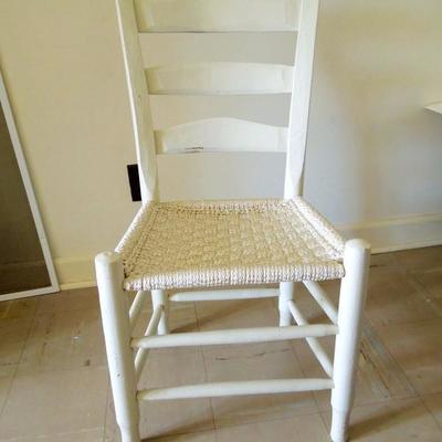 Hand hewn painted antique chair with hand woven seat. Nice!