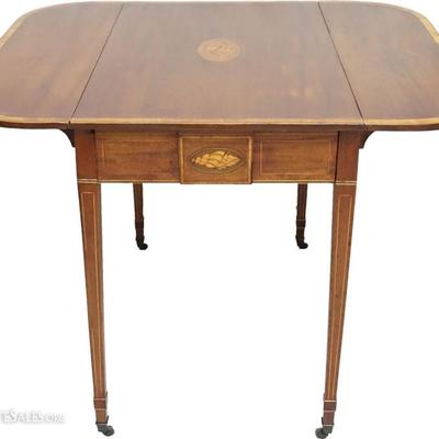 Antique American Federal Pembroke Drop Leaf Table with mahogany main wood and distinctive contrasting shell and banded inlays. The top...
