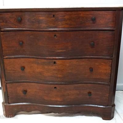 Lot 40- Antique American Victorian Mahogany Serpentine Chest. White shaped and beveled edge marble top. Four drawers, in very good...