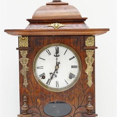Ornate Victorian Mantle / Parlor Clock. Incised oak case, brass cherub and rosette accents, porcelain enameled face, roman numerals,...