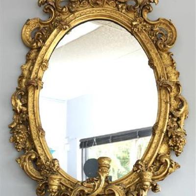 Antique early 19th c. Girandole Mirror. A superb example, this wall mirror is framed in giltwood and gesso, the molding around the later...