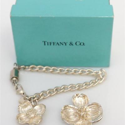 Two Vintage Tiffany Sterling Silver Dogwood Jewelry Items. The first a Sterling Silver Tiffany & Co. Bracelet with dogwood flower charm...