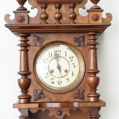 German Regulator Wall Clock c. 1890-1920. Walnut , the whole decorated with turned and carved finials, half columns, enameled porcelain...