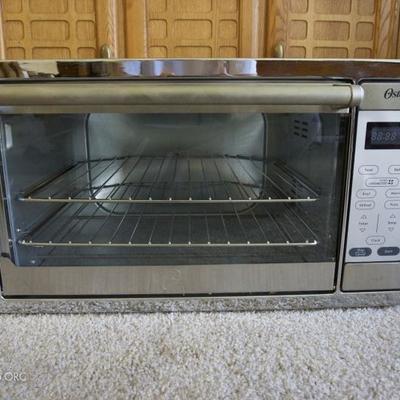 A stainless Oster toaster oven