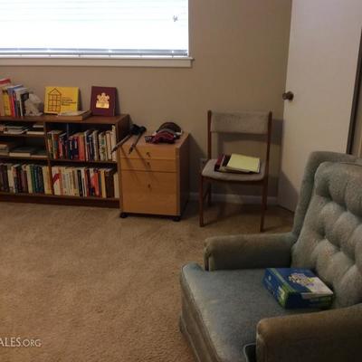 Book shelf, dresser, chair, ski equipment, books