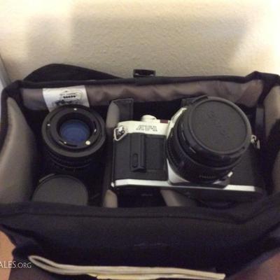 camera, spare lens, and bag