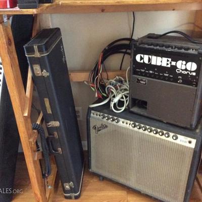 amps and guitar with case