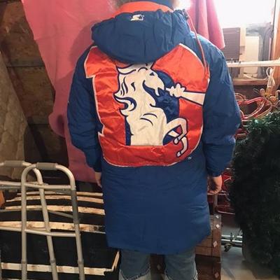 Stay warm at the game in this like new Denver Bronco coat