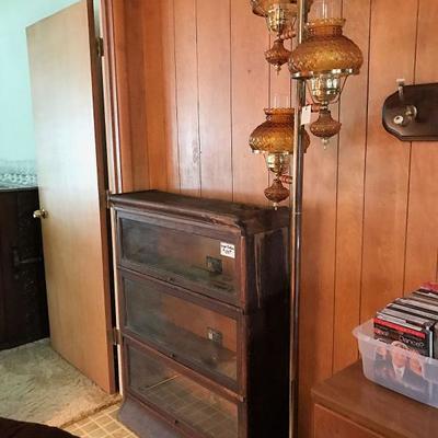 Antique lawyer's bookcase and vintage 70's pole lamp