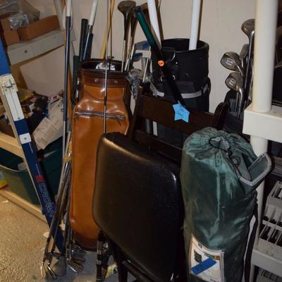 golf clubs and fishing poles 