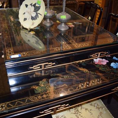 Oriental dining table with 8 chairs and 2 leaves.  Glass top 