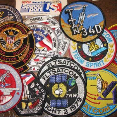 many vintage NASA space shuttle collectable patches pins and stickers (many unique as gentleman worked on several projects),

