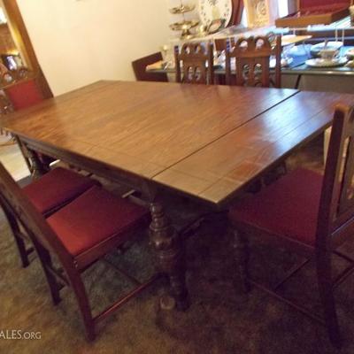 Antique dining table and 6 chairs $370