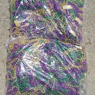 Two bags of Mardi Gras beads