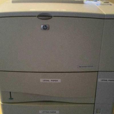 HP Laserjet 4100dtn printer. NO WIFI has cable prints from by pass tray