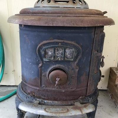 Antique wood stove, lots of character!