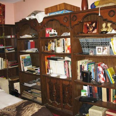 wall of books and shelving units