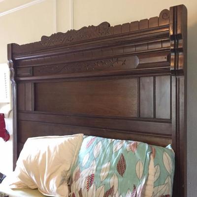 bed with wood headboard
