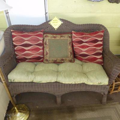 Wicker type loveseat with cushion and pillows $65..NOW $32.50