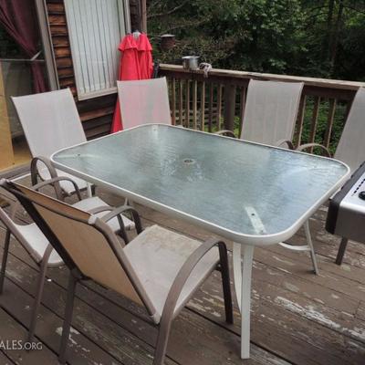 pation table with six chairs, umbrellas