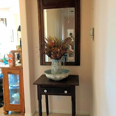 Antique table, mirror, and pitcher with bowl