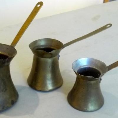 Antique hand made measuring cups.