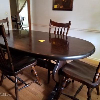 Hardwood dining table with 4 chairs. Excellent condition.