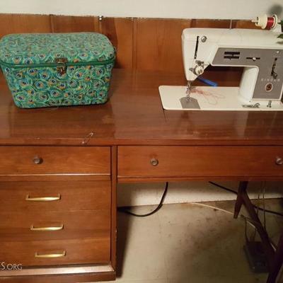 Singer Sewing machine with cabinet.  Sewing basket