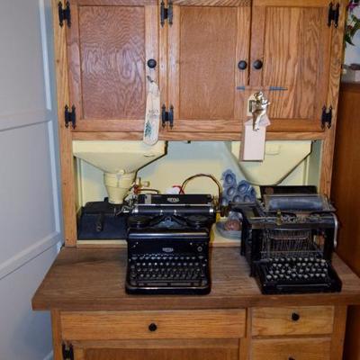 Vintage typewriters on a wonderful old Hoosier