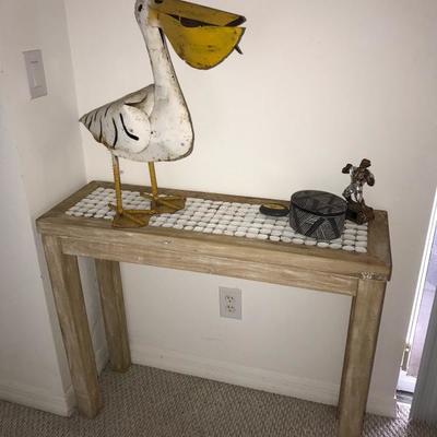 wood accent table, metal pelican decor, stone trinket box