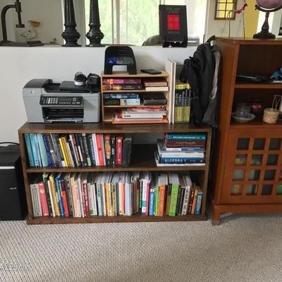 wood bookcase, books, printer, computer towers
