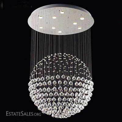 STUNNING 9 LIGHT CRYSTAL CHANDELIER WITH SUSPENDED FACETED ORBS FORMING A LARGE BALL