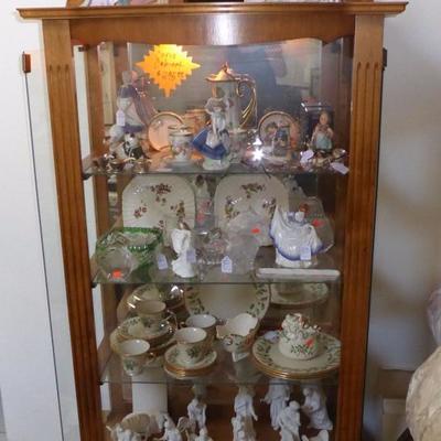 Curio cabinet full of collectibles