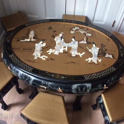  hand painted in Chinese courtyard design and decorated with mother of pearl maiden figures; six matching stools have the gold scenery...