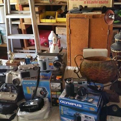Vacuums, ladders,  ironing board,  lp's, camping supplies, vintage toys, trophies
