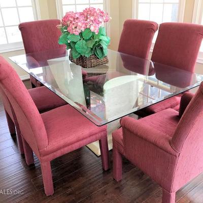 Colorful glass top dining table with 6 tall back chairs