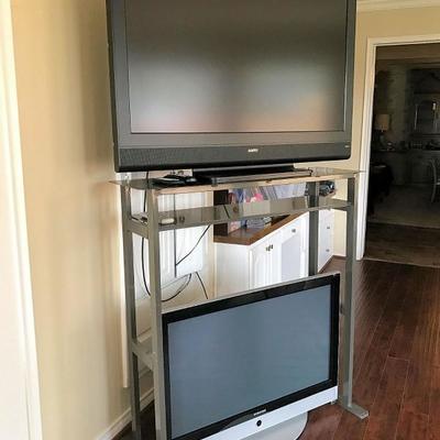 Two of three large screen tv's