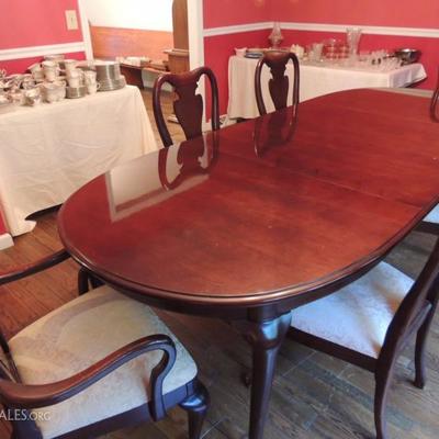Large dining table with two leaves, four chairs, and two arm chairs. * one arm chair has damage but set is priced well below market value...