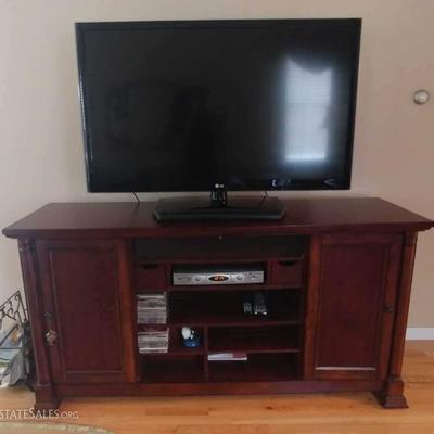 55 inch LG Flat Screen TV on Bassett Credenza with dual closing doors and built in sound bar