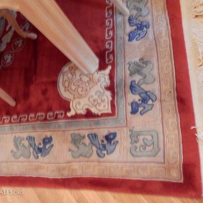 Lot # 106  Oriental Carpet   Red design is 8 x 10  $950.00