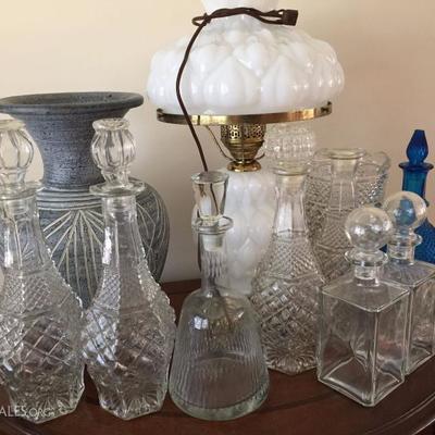 Selection of glass decanters and lamp