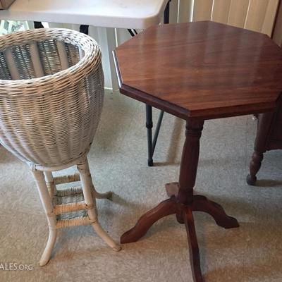 Pedestal table and white wicker plant stand