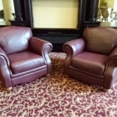 PAIR BURGUNDY LEATHER CLUB CHAIRS, ROLL ARMS, VERY GOOD CONDITION WITH SOME SCUFFS TO BOTTOM CORNER OF ONE CHAIR