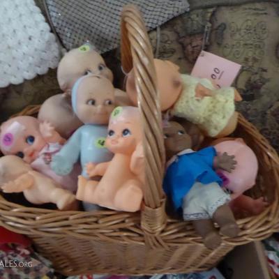Basket of vintage Cupie Dolls