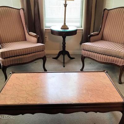 Marble top coffee table, wing back chairs, and Duncan Phyfe style table
