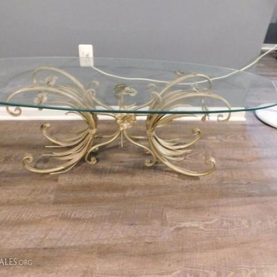 glass topped coffee table with metal floral base
