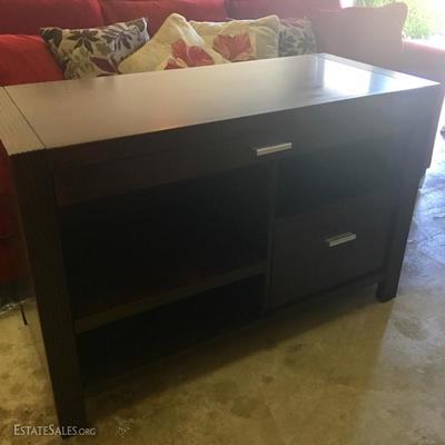 Dark wood table cabinet matching a bookcase