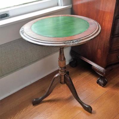 Green leather-topped table.